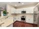 Beautiful kitchen featuring stainless steel appliances and bright white cabinets at 4266 S Winter Ln, Gilbert, AZ 85297