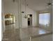 Bright living room featuring tile floors, a ceiling fan, neutral paint, and a half wall with decorative railing at 4537 E Shomi St, Phoenix, AZ 85044