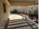 Covered patio with stone landscaping providing a private outdoor area at 4537 E Shomi St, Phoenix, AZ 85044