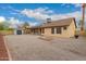 Home's backyard with low-maintenance gravel and a storage shed at 4537 E Towne Ln, Gilbert, AZ 85234