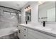 Bathroom with double sinks, white cabinets, and black fixtures at 4537 E Towne Ln, Gilbert, AZ 85234