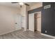 This bedroom features wood-look floors, a closet, and a ceiling fan at 4537 E Towne Ln, Gilbert, AZ 85234