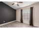 Clean bedroom featuring neutral colors, hardwood floors, and an abundance of natural light at 4537 E Towne Ln, Gilbert, AZ 85234