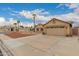 Charming single-story home featuring a well-manicured front yard and attached two-car garage at 4537 E Towne Ln, Gilbert, AZ 85234