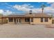 Back exterior of the home featuring solar panels and a covered patio at 4537 E Towne Ln, Gilbert, AZ 85234