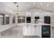 Beautiful white kitchen featuring a modern island, sleek appliances, and an open breakfast nook at 4537 E Towne Ln, Gilbert, AZ 85234