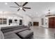 Open-concept living room featuring hardwood floors, recessed lighting, and lots of natural light at 4537 E Towne Ln, Gilbert, AZ 85234