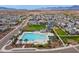 A beautiful aerial view of the community pool, park, and playground surrounded by lovely single-Gathering homes at 5811 W Encinas Ln, Phoenix, AZ 85043