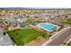 Aerial view showcases pool, community park, green spaces, and playground in planned community at 5811 W Encinas Ln, Phoenix, AZ 85043