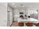 Modern kitchen featuring white cabinets, quartz countertops, and stainless steel appliances at 5811 W Encinas Ln, Phoenix, AZ 85043