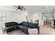 Open living room flows into kitchen with light hardwood flooring at 5811 W Encinas Ln, Phoenix, AZ 85043