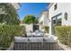 Charming courtyard with a cozy seating area, manicured hedges, and desert landscape views at 5858 E Caballo Dr, Paradise Valley, AZ 85253