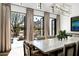 A dining room with an outdoor view showcases stylish decor and seating for eight guests at 5858 E Caballo Dr, Paradise Valley, AZ 85253