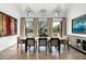 A dining room with vaulted ceilings and an outdoor view offers ample seating and natural light at 5858 E Caballo Dr, Paradise Valley, AZ 85253