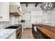 Bright, spacious kitchen with white cabinetry, marble countertops, and a large island with seating at 5858 E Caballo Dr, Paradise Valley, AZ 85253