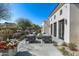 Relaxing patio area with stylish seating, complemented by beautiful flowers and landscaping, great for outdoor gatherings at 5858 E Caballo Dr, Paradise Valley, AZ 85253