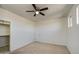 Bedroom with plush carpet, neutral walls, ceiling fan and a closet at 6192 S Claiborne Ave, Gilbert, AZ 85298