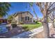 Cozy single story home with stone accents, mature trees, and a low maintenance desert landscape at 6192 S Claiborne Ave, Gilbert, AZ 85298