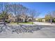 Attractive home with a well-kept lawn, appealing stone accents, and a spacious three-car garage at 6192 S Claiborne Ave, Gilbert, AZ 85298