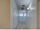 Neutral hallway with carpet flooring, white walls, and access to rooms and stairway at 6192 S Claiborne Ave, Gilbert, AZ 85298