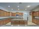 A kitchen featuring abundant cabinets, granite countertops, and an expansive central island at 6192 S Claiborne Ave, Gilbert, AZ 85298