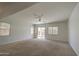 Bright living room features large windows and a sliding glass door for outdoor access at 6192 S Claiborne Ave, Gilbert, AZ 85298