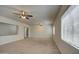 Expansive living room with natural light, multiple windows, and ceiling fans at 6192 S Claiborne Ave, Gilbert, AZ 85298