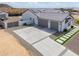 Aerial view of a home with solar panels and spacious driveway at 6645 N Paint Ln, Casa Grande, AZ 85194