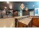 Finished basement bar featuring wooden cabinetry and a concrete countertop at 6645 N Paint Ln, Casa Grande, AZ 85194