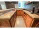 Finished basement bar featuring wooden cabinetry and a concrete countertop and a wine rack at 6645 N Paint Ln, Casa Grande, AZ 85194