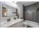 Modern bathroom featuring a white vanity, quartz countertop, and gray subway tile in the shower at 6645 N Paint Ln, Casa Grande, AZ 85194