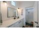 Modern bathroom with a large mirror, sleek vanity, and an adjacent shower/tub combination at 6645 N Paint Ln, Casa Grande, AZ 85194