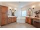 Large bathroom with dual vanities and cabinetry surrounding a soaking tub at 6645 N Paint Ln, Casa Grande, AZ 85194