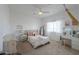 Bright bedroom boasting a ceiling fan, white walls, and natural light from an adjacent window at 6645 N Paint Ln, Casa Grande, AZ 85194