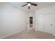 Bedroom with carpet floors, ceiling fan, and closet at 6645 N Paint Ln, Casa Grande, AZ 85194