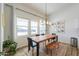 Cozy dining room featuring a wooden table and lots of natural light at 6645 N Paint Ln, Casa Grande, AZ 85194