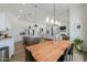 Open-concept dining area featuring a modern light fixture at 6645 N Paint Ln, Casa Grande, AZ 85194