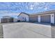 Spacious driveway leading to a three-car garage at 6645 N Paint Ln, Casa Grande, AZ 85194