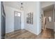 Bright entryway featuring stylish decor, wood-look tile flooring, and natural lighting at 6645 N Paint Ln, Casa Grande, AZ 85194