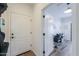 Hallway view into a bright and spacious room, featuring a styling chair and styling equipment at 6645 N Paint Ln, Casa Grande, AZ 85194