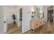 Upstairs hallway featuring a decorative table and hardwood floors at 6645 N Paint Ln, Casa Grande, AZ 85194