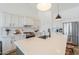 Bright kitchen with white cabinets, stainless steel appliances and stone countertops at 6645 N Paint Ln, Casa Grande, AZ 85194