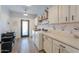 Well-equipped laundry room with modern appliances, ample counter space, and custom cabinetry at 6645 N Paint Ln, Casa Grande, AZ 85194