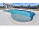 Inviting backyard pool with stone surround, mountains in the distance at 6645 N Paint Ln, Casa Grande, AZ 85194