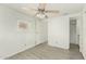 Bedroom featuring wood-look flooring, a ceiling fan, and a bathroom with a stand-up shower at 730 S Country Club Dr # 5, Mesa, AZ 85210