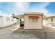 Charming mobile home featuring a covered porch and neutral exterior at 730 S Country Club Dr # 5, Mesa, AZ 85210