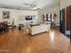 A naturally lit living room featuring hardwood floors, an open concept, and exposed ductwork at 7301 E 3Rd Ave # 101, Scottsdale, AZ 85251