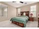 Cozy bedroom with carpet, a ceiling fan and a large wood headboard at 7421 W Montgomery Rd, Peoria, AZ 85383