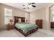 Bedroom with carpet, a ceiling fan, and wood furniture at 7421 W Montgomery Rd, Peoria, AZ 85383