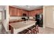 Kitchen with granite counters, center island, and stainless steel appliances at 7421 W Montgomery Rd, Peoria, AZ 85383